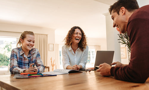 Smiling family together at home