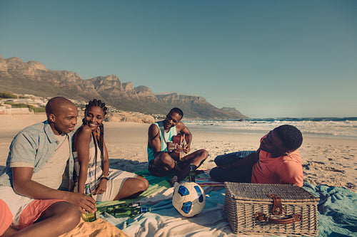 Group of friends relaxing at the beach