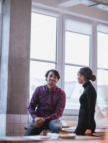 Young people talking in office