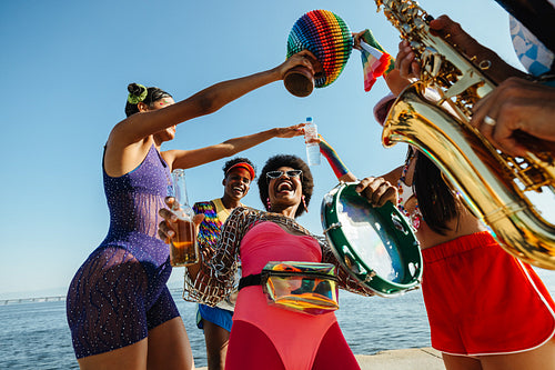 Carnaval celebration with friends on the beach