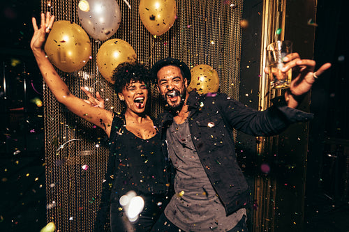 Energetic couple dancing in the night club