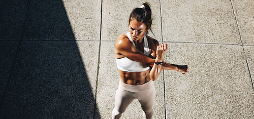 Sportswoman doing warmup exercises