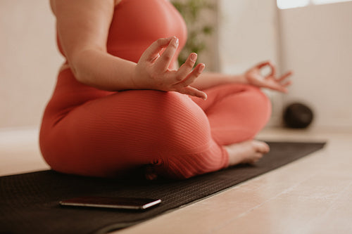 Woman doing meditating at gym