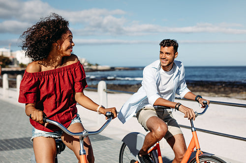 Happy couple riding bicycles