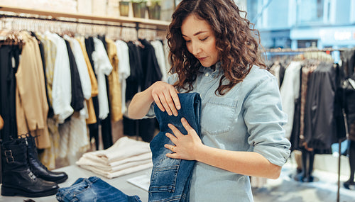 Saleswoman working in fashion store