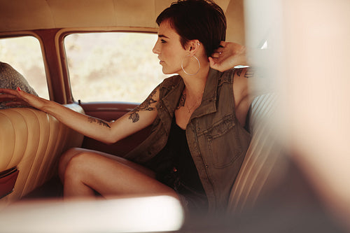 Woman traveling by a car