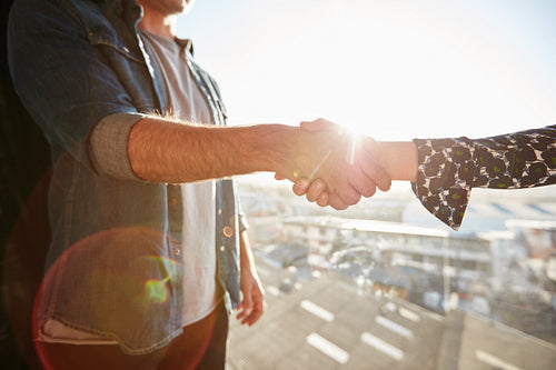 Shaking hands with lens flare