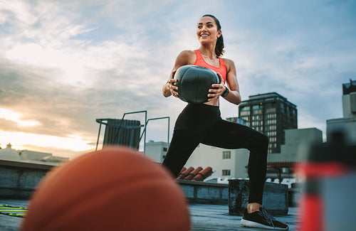 Fitness woman doing workout using a medicine ball
