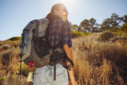 Young woman hiking on summer day