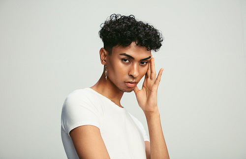 Portrait of gay man with earring 