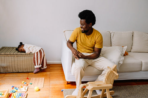 Father and daughter in living room