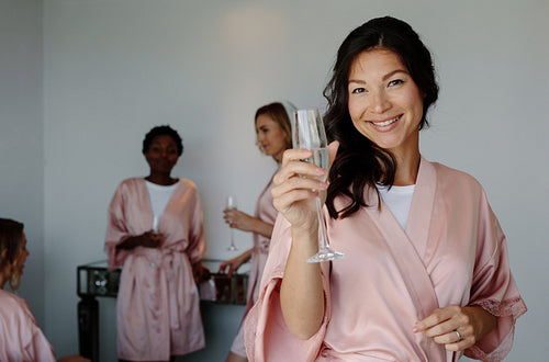 Women celebrating hen party in a bedroom