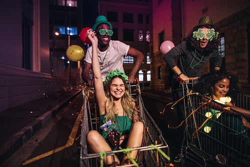 Friends at night with confetti enjoying party