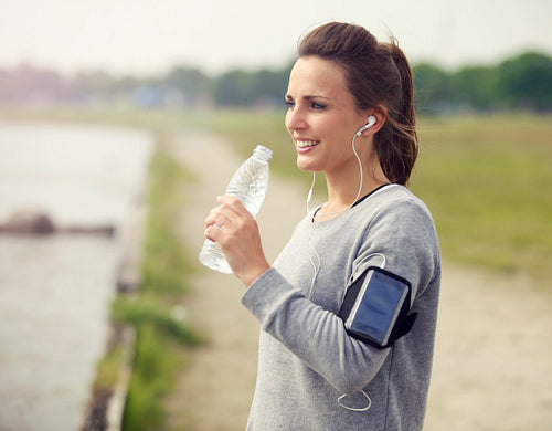 Female Runner Drinking Bottled Water