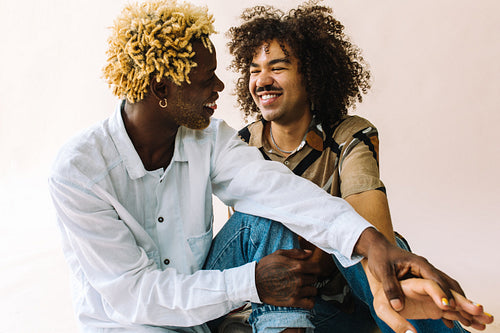 Queer lovers smiling at each other