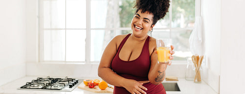 Fitness woman with glass of fruit juice