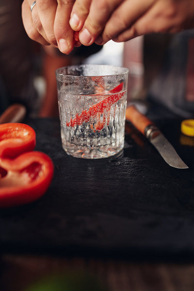 Bartender hands preparing cocktail