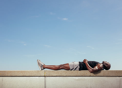 African man relaxing after his workout 