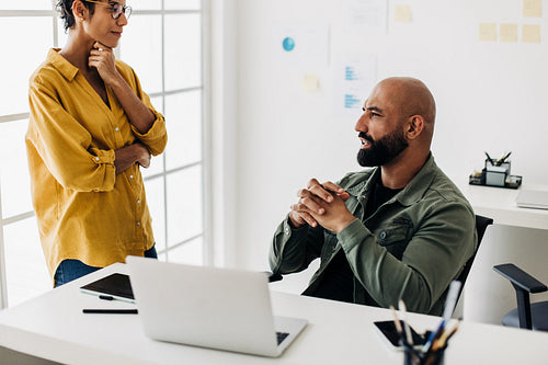 Designers having a discussion in an office