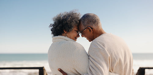 Mature couple sharing a romantic moment at the beach