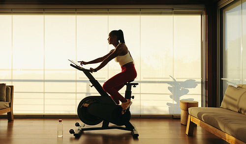 Black woman takes control of health in virtual fitness class