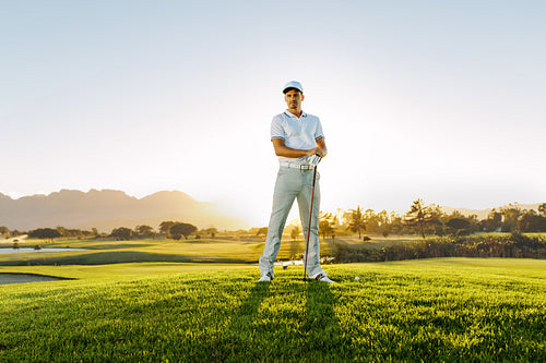 Male golfer standing on golf course