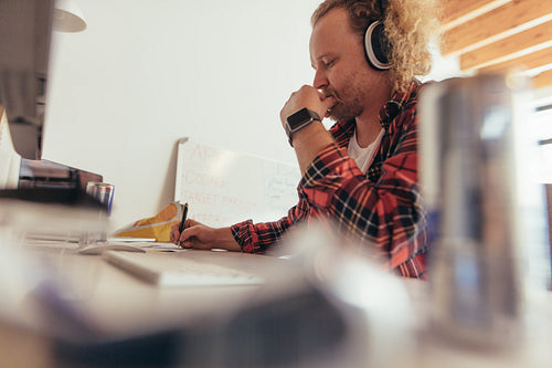 Experience tech professional coding on a notepad