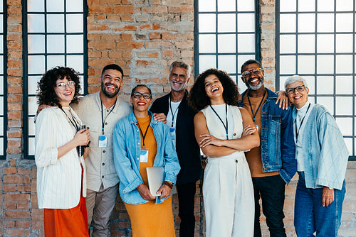 Happy diverse business team portrait showcasing unity and creativity