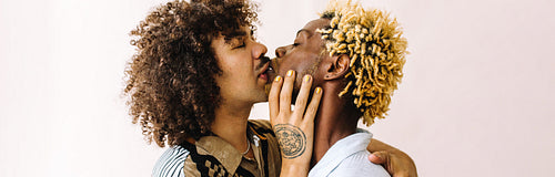 Gay couple kissing passionately