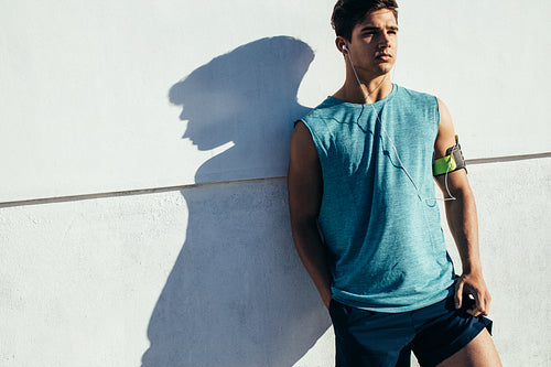 Male runner relaxing after workout