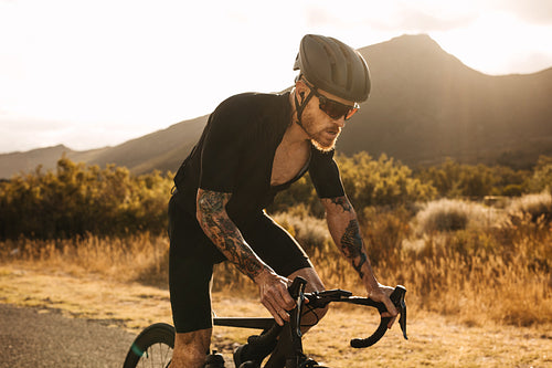 Cyclist putting effort in riding bike