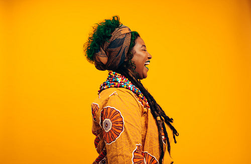 Woman laughing happily in a studio