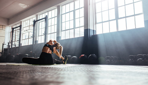 Young woman training in gymnasium.