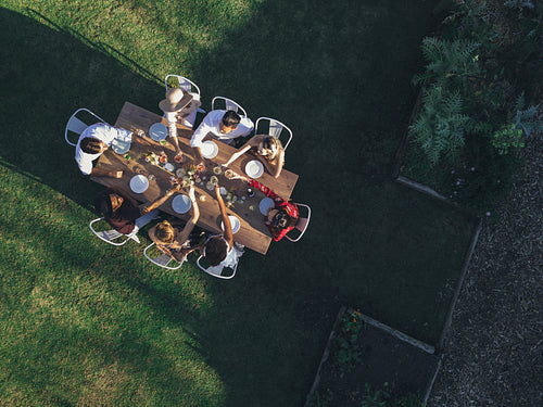 Aerial view of friends toasting drinks