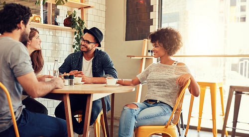 Young friends relaxing in cafe