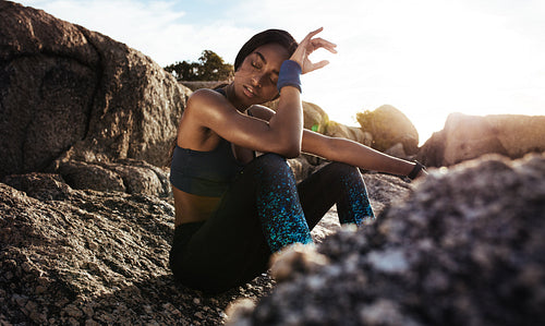Tired woman resting after workout