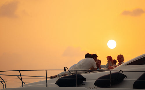 Dreamy family vacation at sunset on a luxury yacht