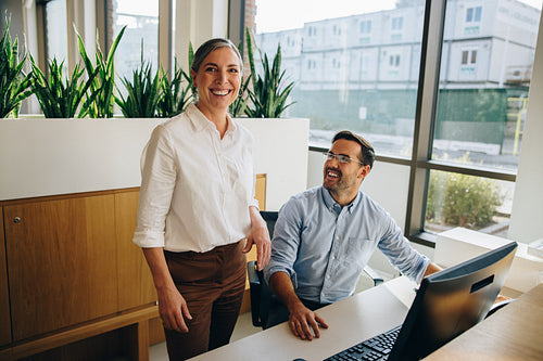 Happy office colleagues at work