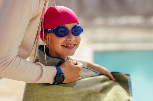 Girl in towel after swimming lesson