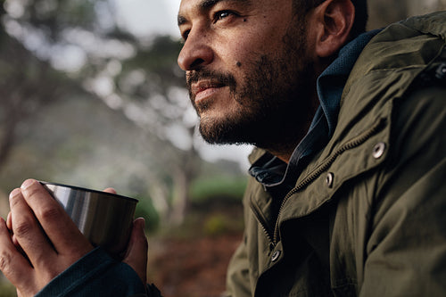 Male hiker taking rest outdoors