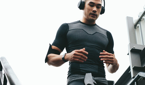 Sporty man running downstairs