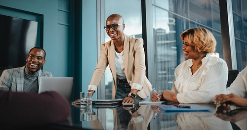 Group of colleagues having a successful business meeting in a professional office