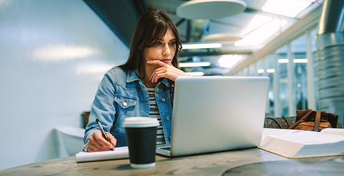 Woman student studying at university campus