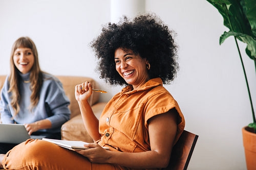 Businesswoman smiling happily while sitting in a meeting