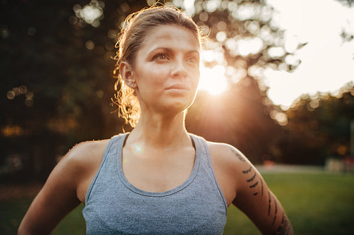 Healthy young woman in sportswear at park