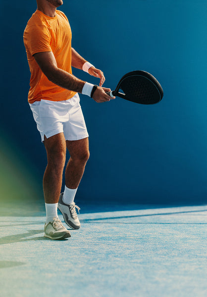Player swinging his racket in a padel match