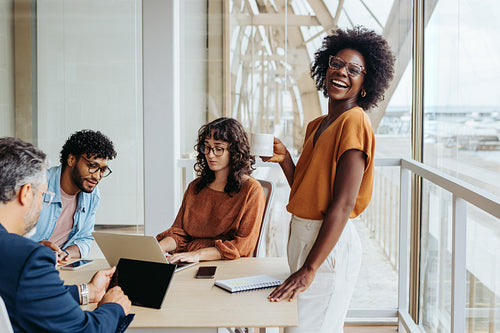 Business woman leading a collaborative team meeting in an office