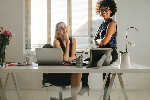 Confident young female business partners
