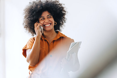 Ethnic businesswoman smiling happily on a phone call