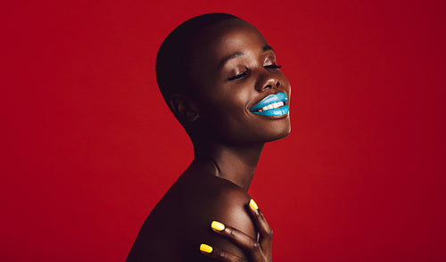 Beautiful african woman with colorful makeup